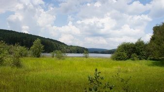 panorama of green valley and lake