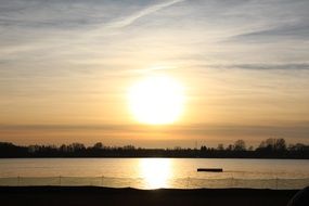 romantic landscape of the lake on the background of the evening sky