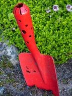 red metal garden shovel