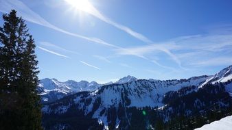 bright sun over winter mountain landscape