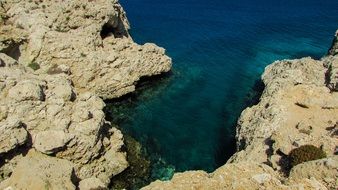 landscape of rocky coast and blue sea water in cape greco