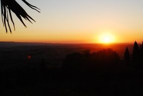 evening landscape with the setting sun on the horizon