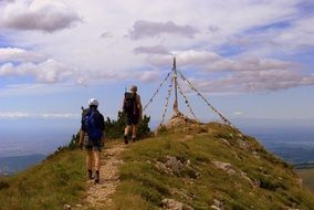 mountain climbers on top of a hill