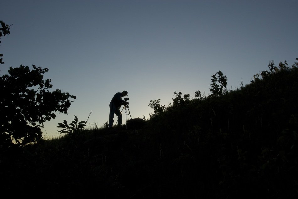 Silhouette of the photographer on the mountain