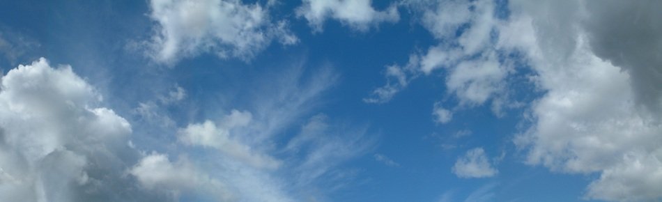 blue sky with white cumulus clouds