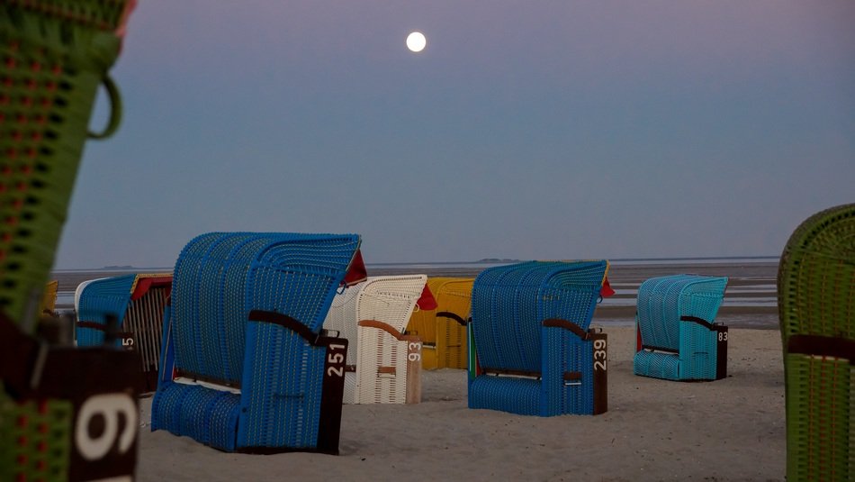 beach cabins at night