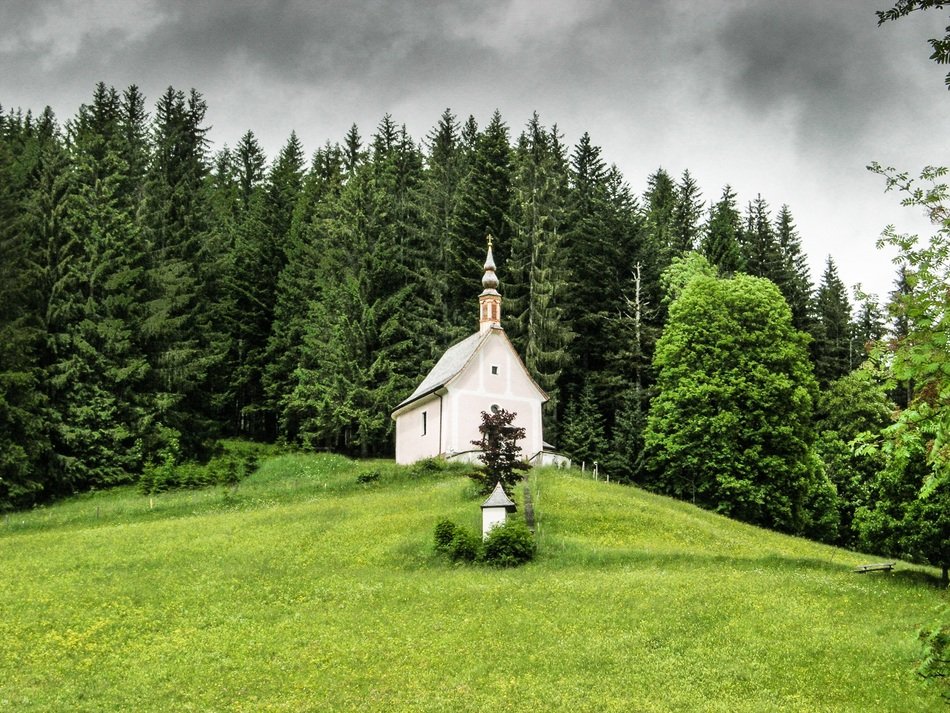 church in the middle of a picturesque landscape in the mountains