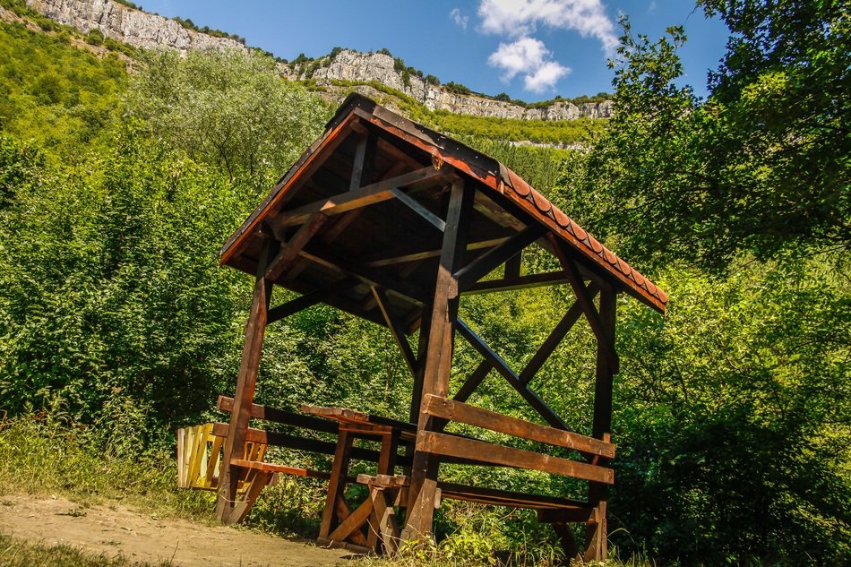 wooden gazebo in the forest foothills