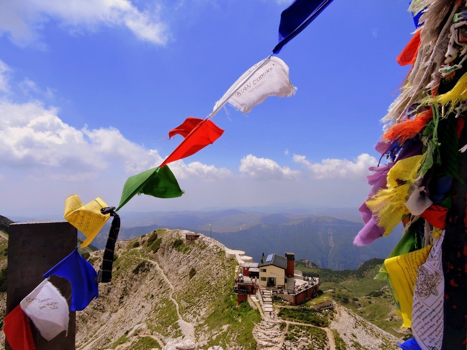 colorful flags in the mountains of italy