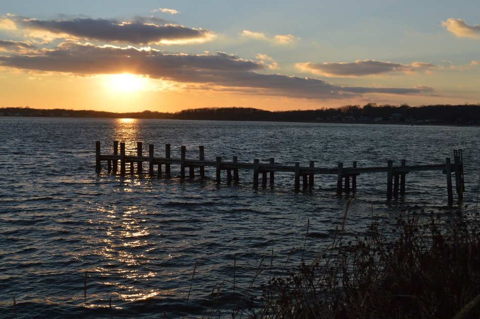 pier in the rays of sunset