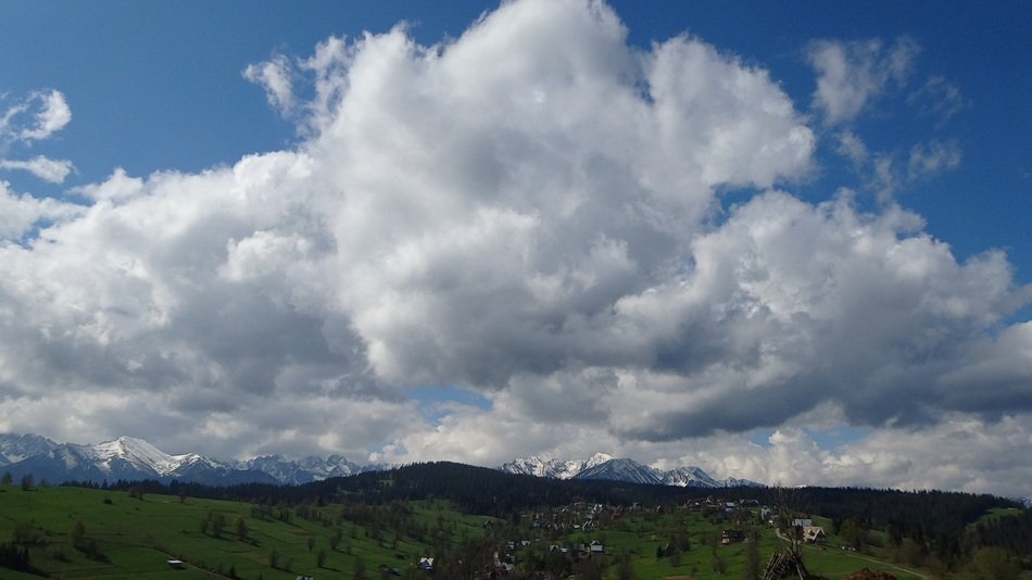 distant view of the high Tatras under white clouds