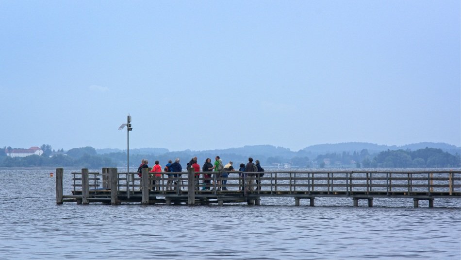 distant view of people on a wooden pier