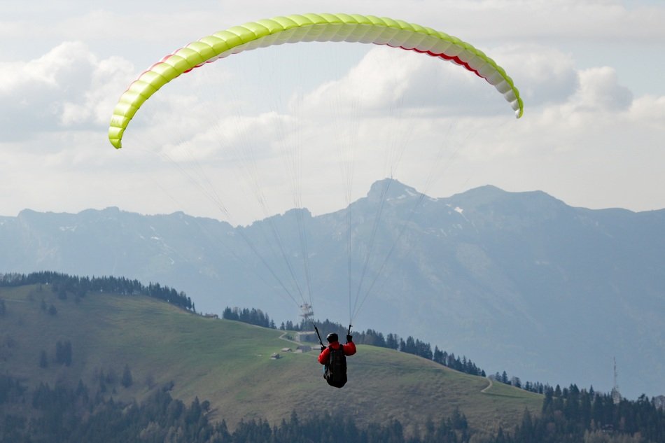 paraglider in the alpine sky