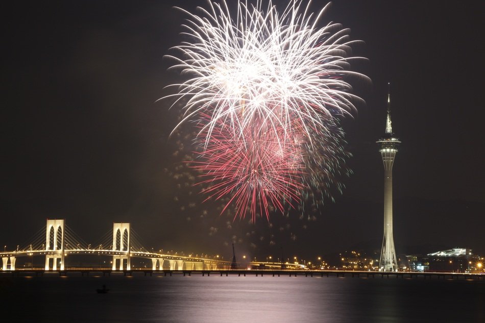 Fireworks at dark sky above city, china, Macau