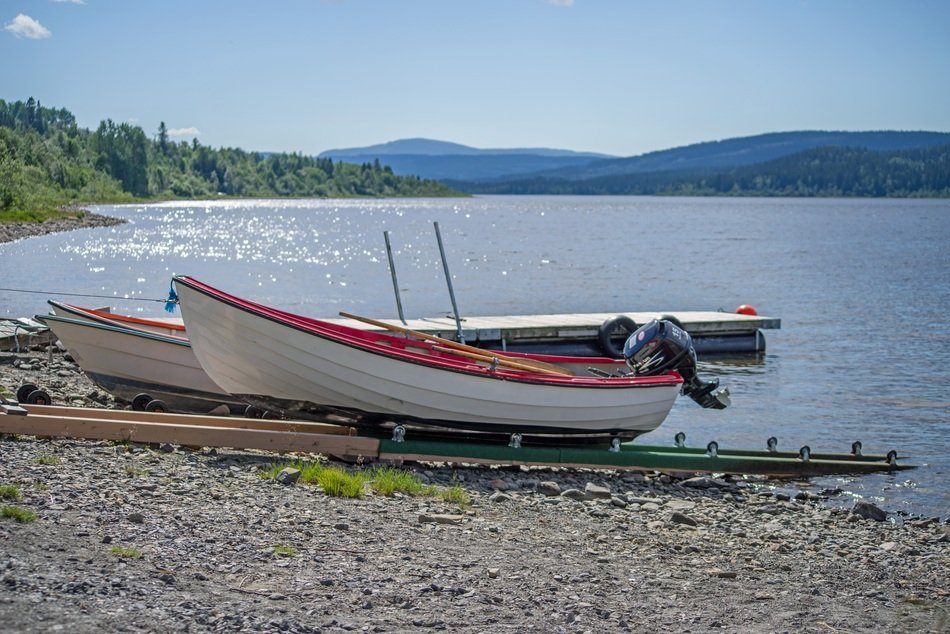 fishing boats with motors on a lake in Sweden