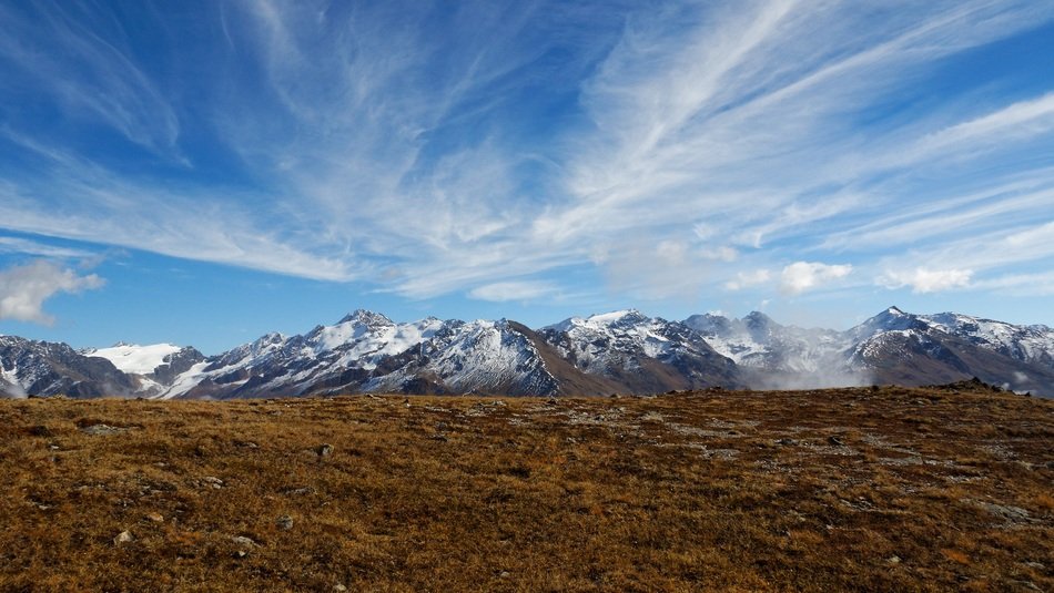 Beautiful landscape with the Alpine mountains and clouds