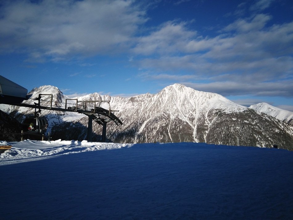 mountains in the snow near the lake in winter