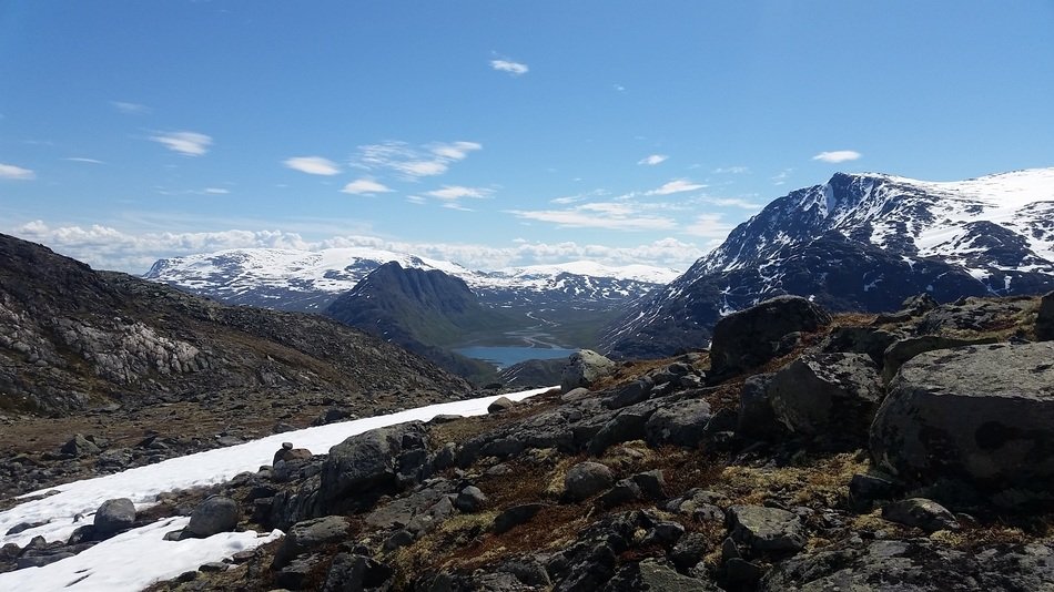 panoramic view of a mountain range in norway on a sunny day