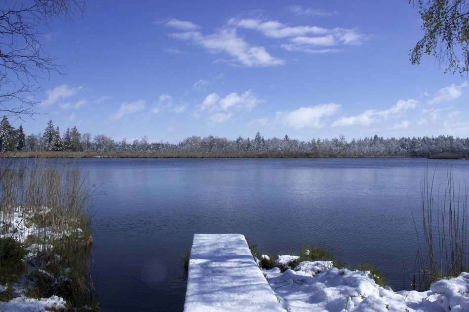 snow on riedsee lake in spring