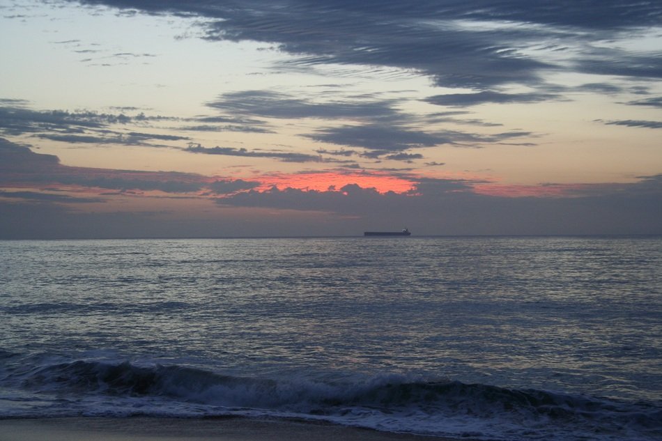 Containership floating on ocean