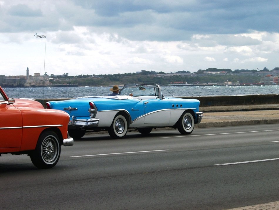 photo of retro convertibles on the road in Havana