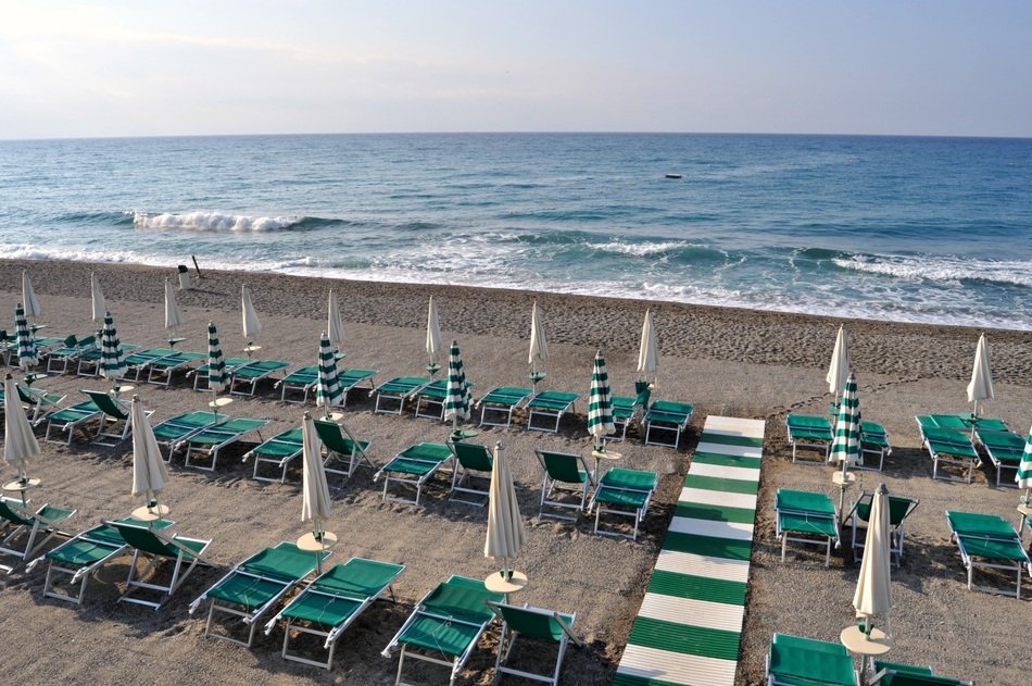 green loungers on the beach