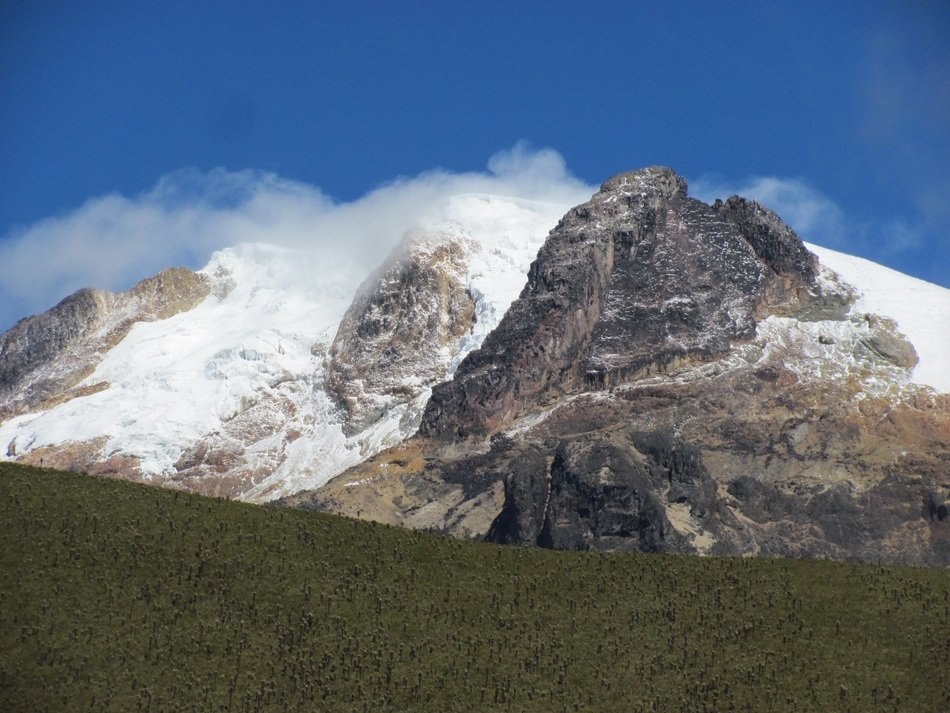 snowy peaks in white clouds in colombia
