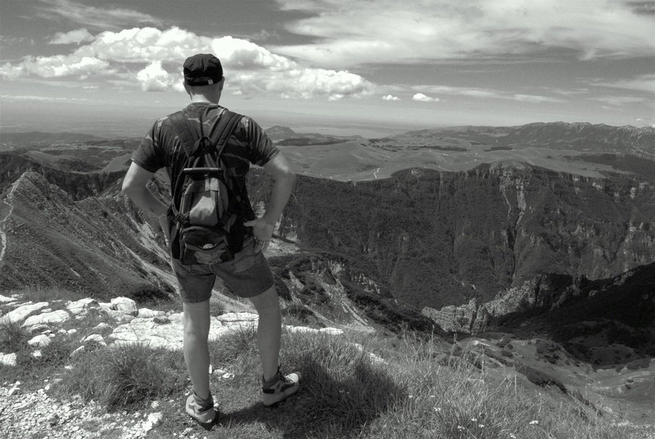 hiker in the mountains in black and white image