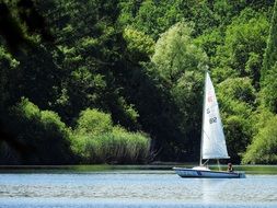 sailing boat on the peaceful lake