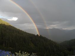 double rainbow over the picturesque mountains
