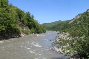 Landscape of River bank in Mountains summer