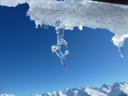 frozen icicle against the blue sky