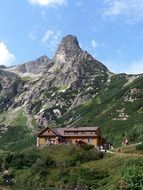 cottage beneath jastrabia tower mountain peak at summer, Slovakia, vysokÃ© tatry