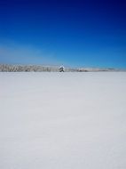 blue sky over a snowy field