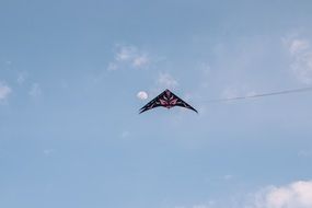 black and red Kite at blue sky