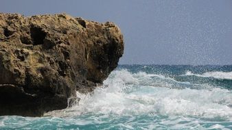 blue sea waves crushing on the rocks
