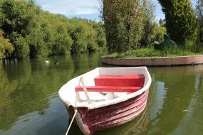 boat on a pond in a picturesque park