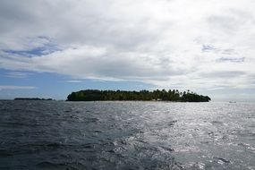 distant view of the ocean and island of Cayo Levantado