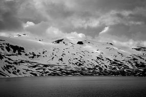 snowy mountains on the coastline in Norway