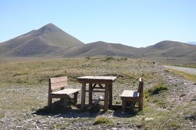 wooden table and benches in view of Mountains, italy, Gran Sasso