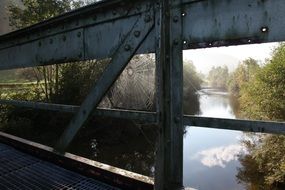 spider web on a wooden bridge