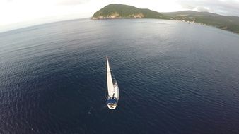 panoramic view of a white sailboat on the water