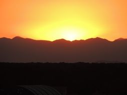 colorful orange sunset over the mountains