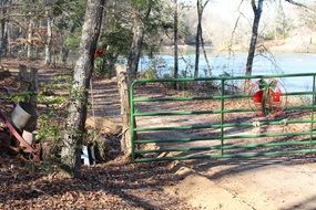 gate on the trail in the autumn forest