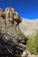 sheer cliff in the mountains in chile on a sunny day