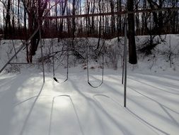 Swing on the playground in winter