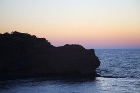 photo of cliff by the sea