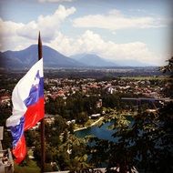 flag on a castle over a city in Slovenia