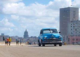 Landscape with the blue vintage auto and Havana on a sunny day