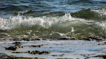 splashing sea waves on the beach close-up